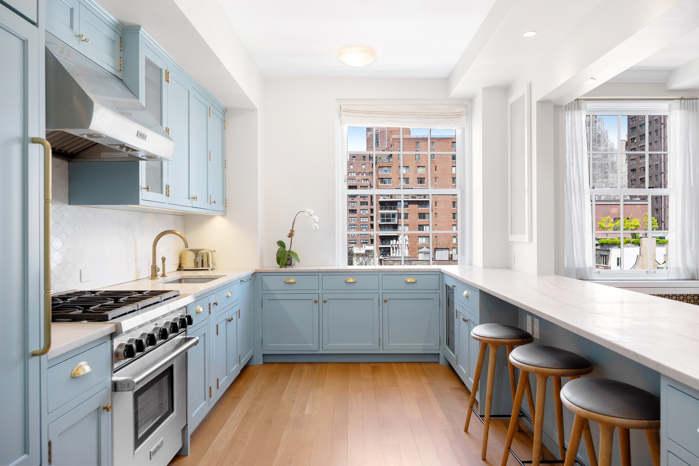 Pale blue prewar kitchen with breakfast bar