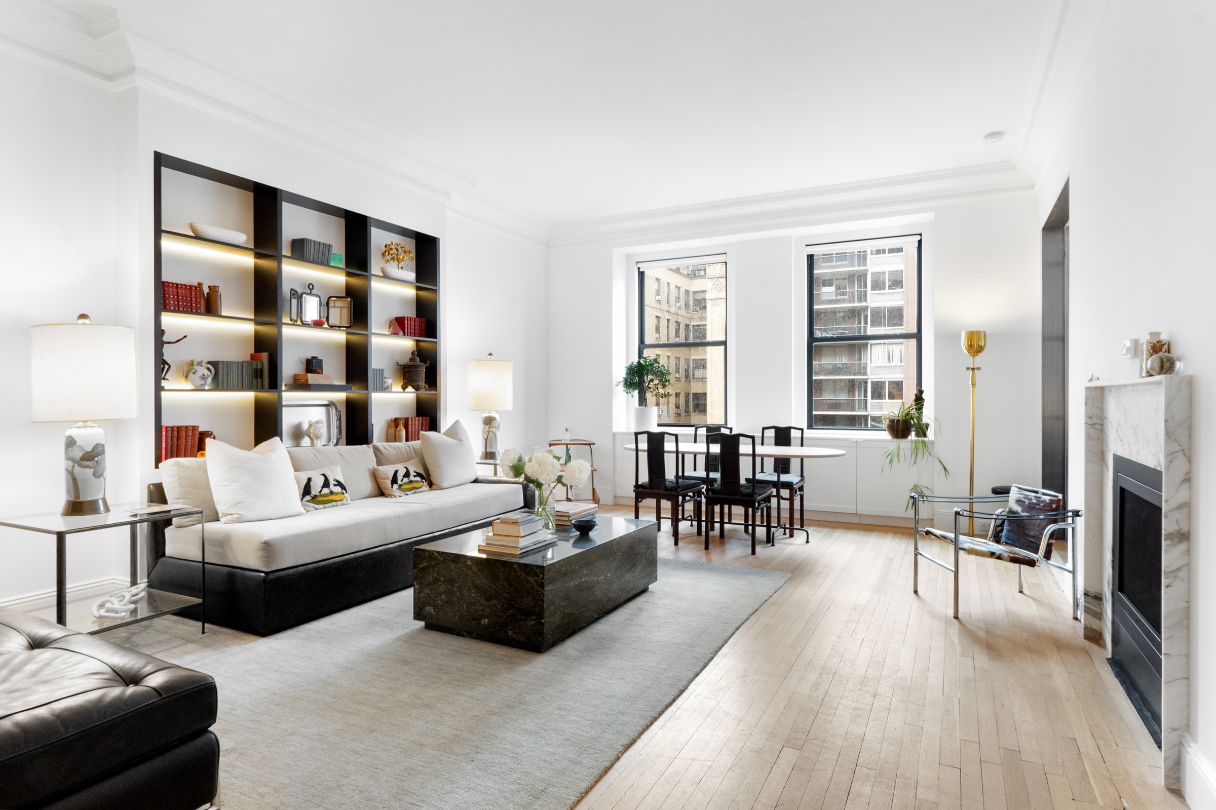 Living room with dark shelving and herringbone floor