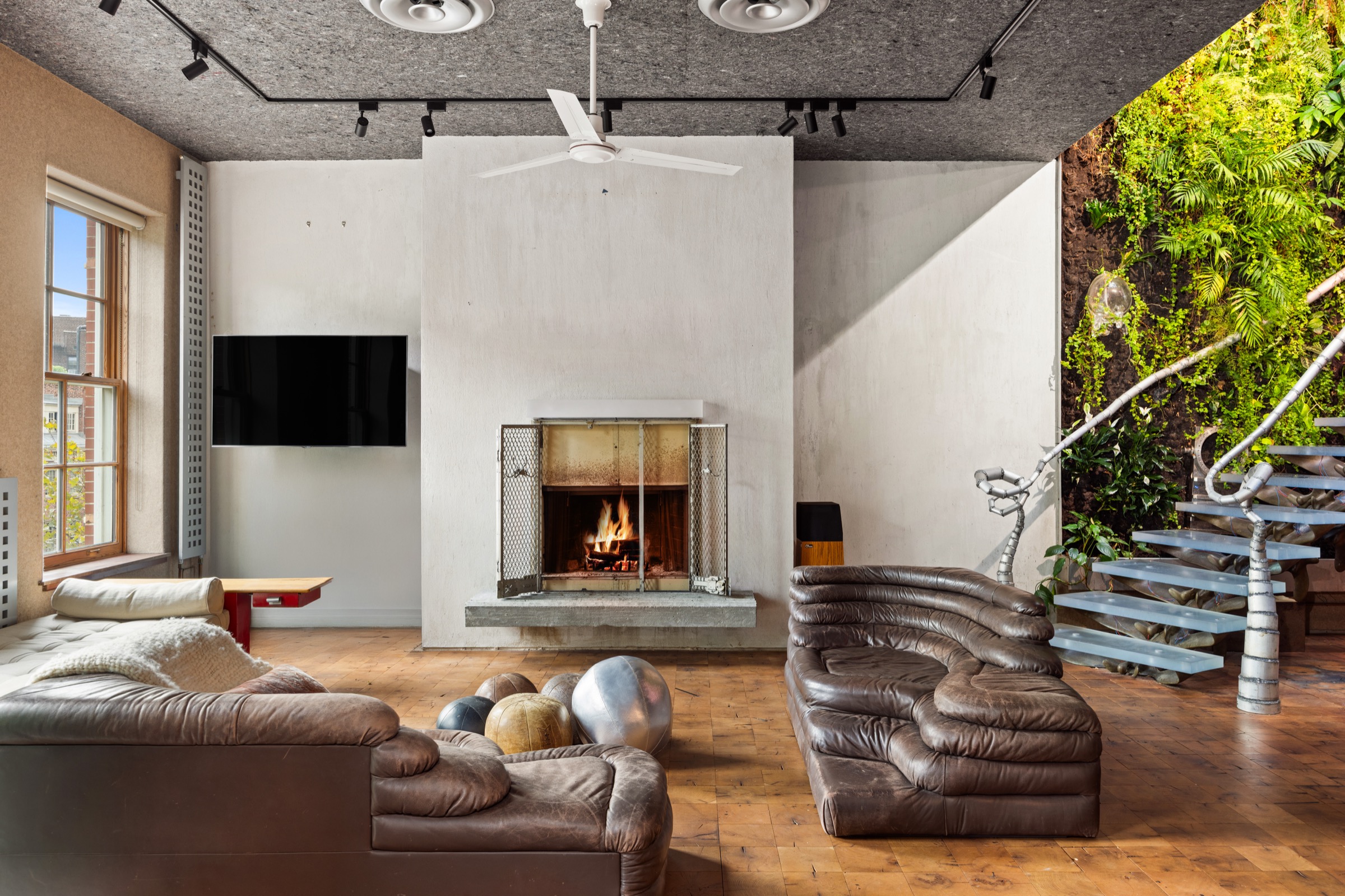 Double-height loft living room with fireplace